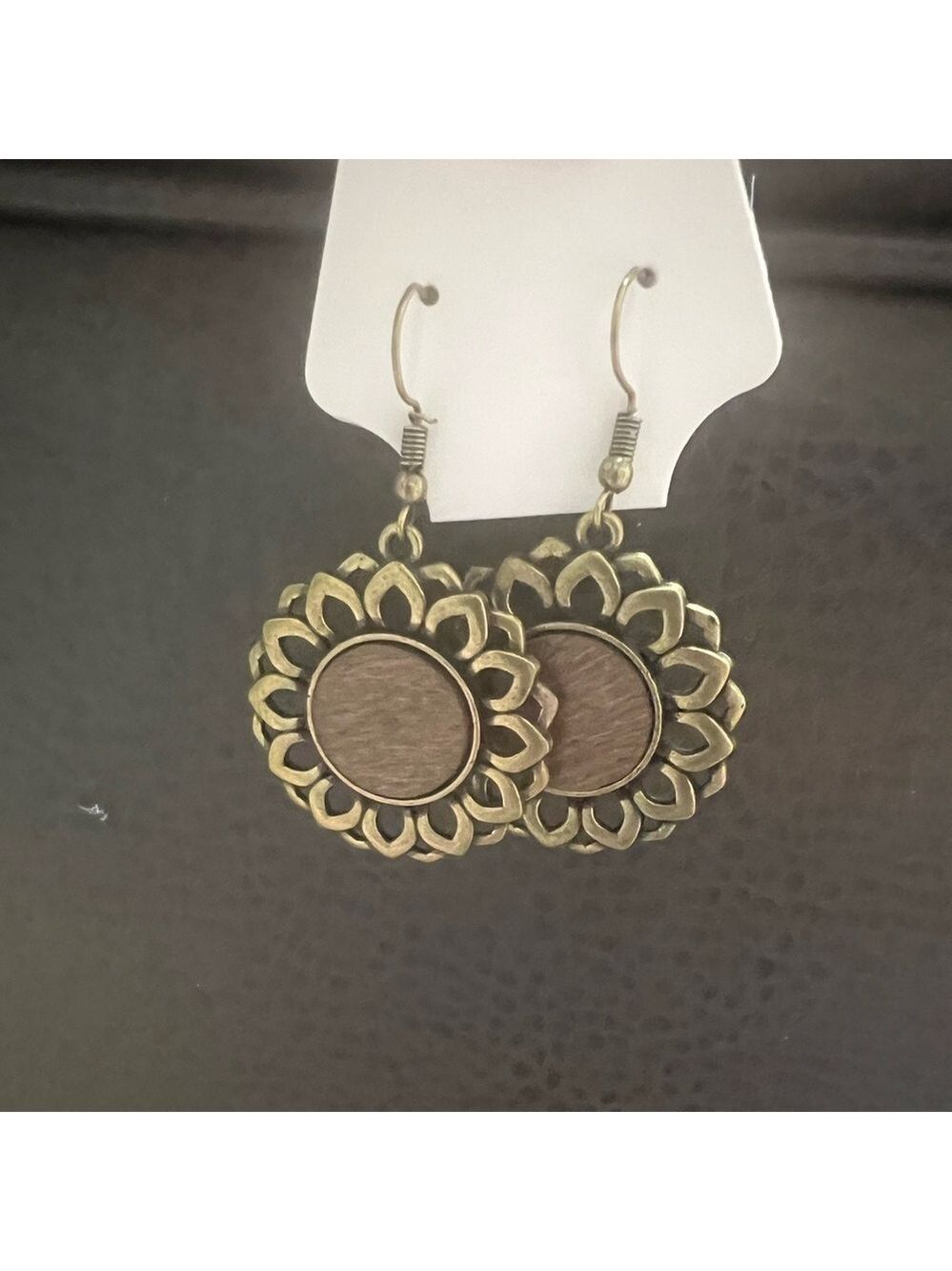 FASHION JEWELRY Copper colored flower with brown wooden circle in middle